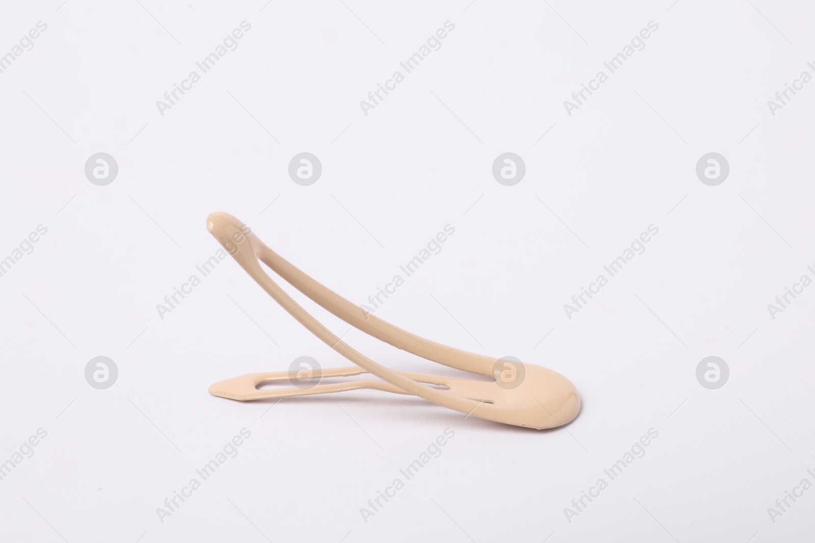 Photo of One beige hair clip on white background