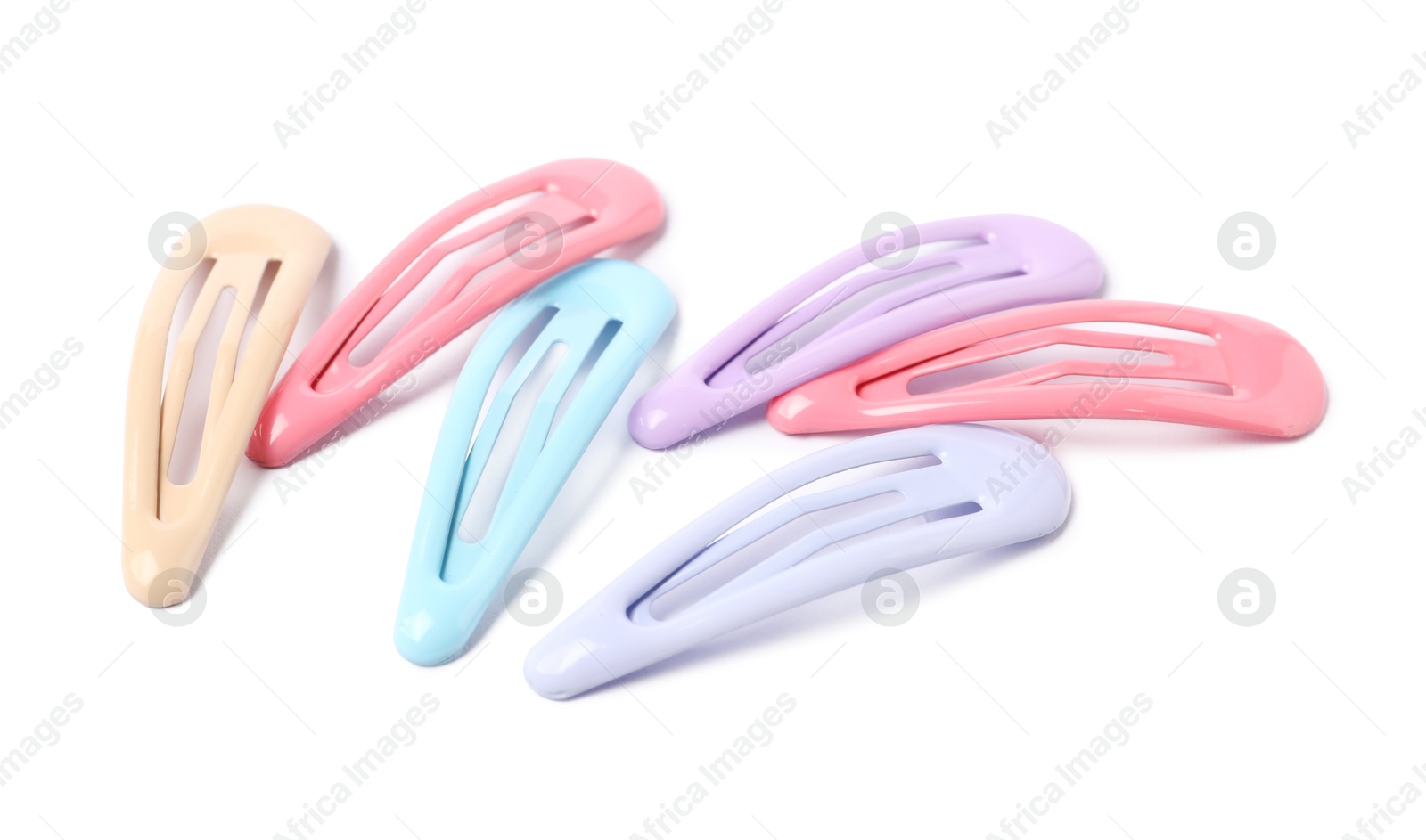 Photo of Many colorful hair clips isolated on white