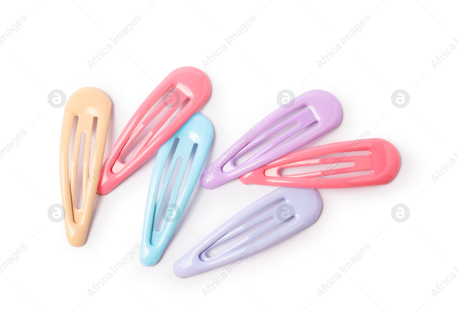 Photo of Many colorful hair clips isolated on white, top view