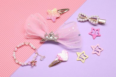 Photo of Cute hair accessories on color background, closeup