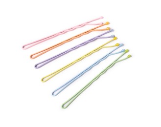 Photo of Many colorful hair pins on white background