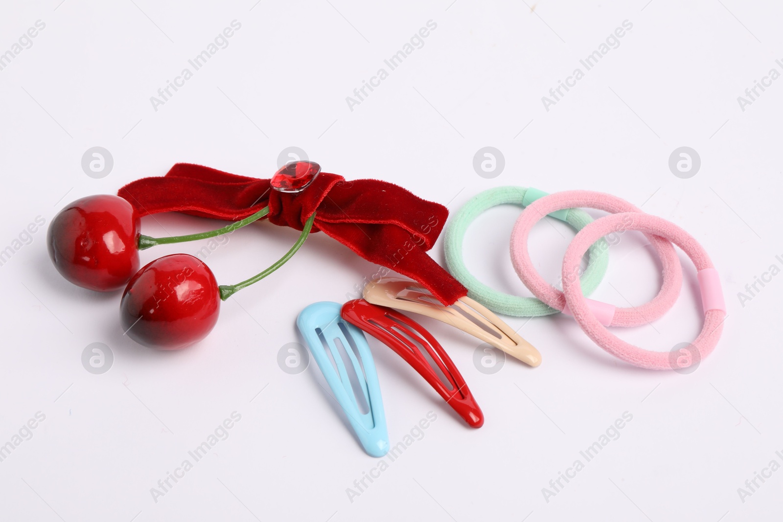 Photo of Colorful cute hair accessories on white background