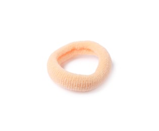 Photo of One peach hair tie isolated on white