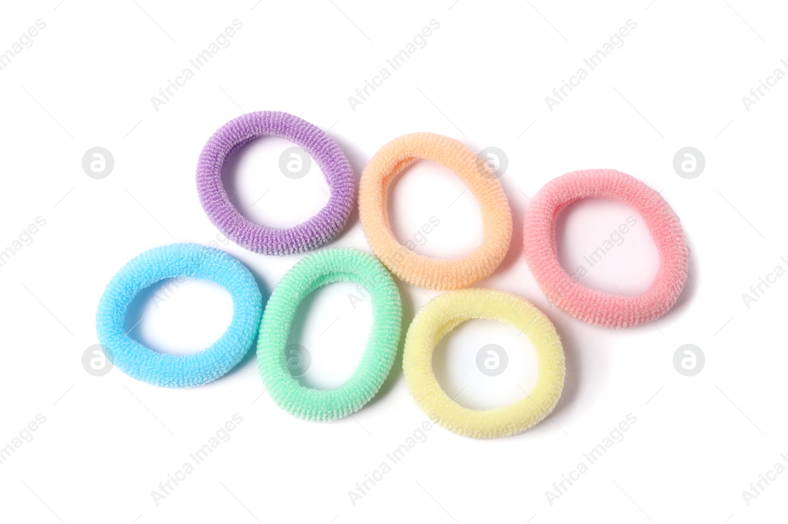 Photo of Many colorful hair ties isolated on white, top view