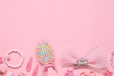 Photo of Cute hair accessories on pink background, flat lay. Space for text