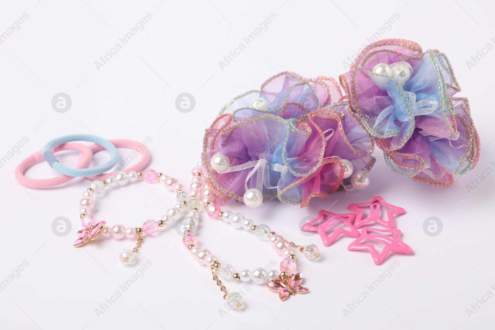 Photo of Colorful cute hair accessories on white background