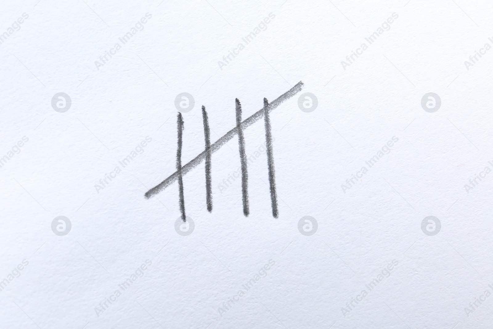 Photo of Counting days by drawing sticks with pencil on white background, closeup