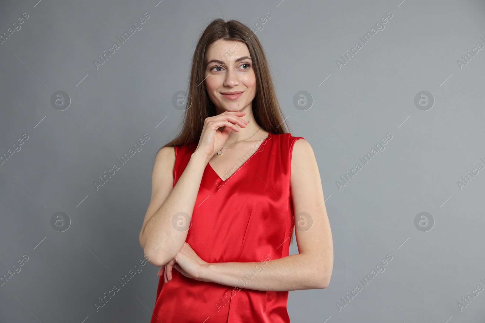 Photo of Beautiful woman in stylish outfit on grey background