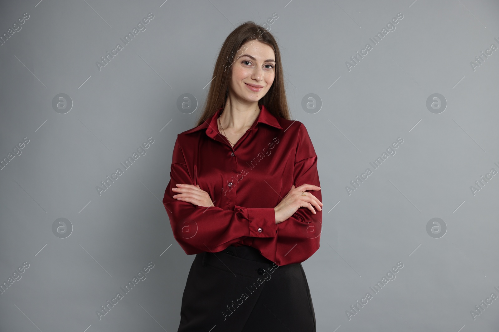 Photo of Beautiful woman in stylish outfit on grey background