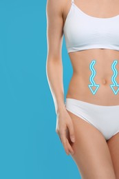 Image of Woman with healthy digestion on light blue background, closeup. Arrows symbolizing proper functioning of digestive tract