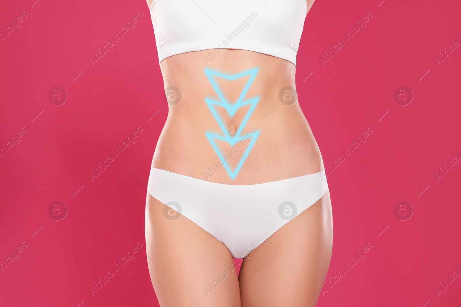 Image of Woman with healthy digestion on crimson color background, closeup. Arrows symbolizing proper functioning of digestive tract