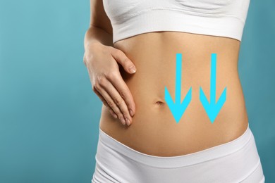 Image of Woman with healthy digestion on light blue background, closeup. Arrows symbolizing proper functioning of digestive tract