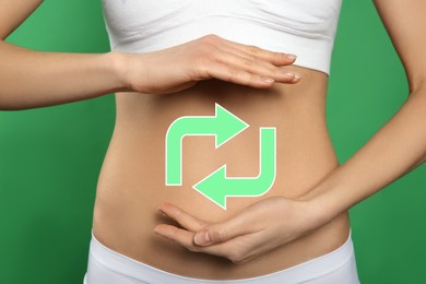 Image of Woman with healthy digestion on green background, closeup. Arrows symbolizing proper functioning of digestive tract