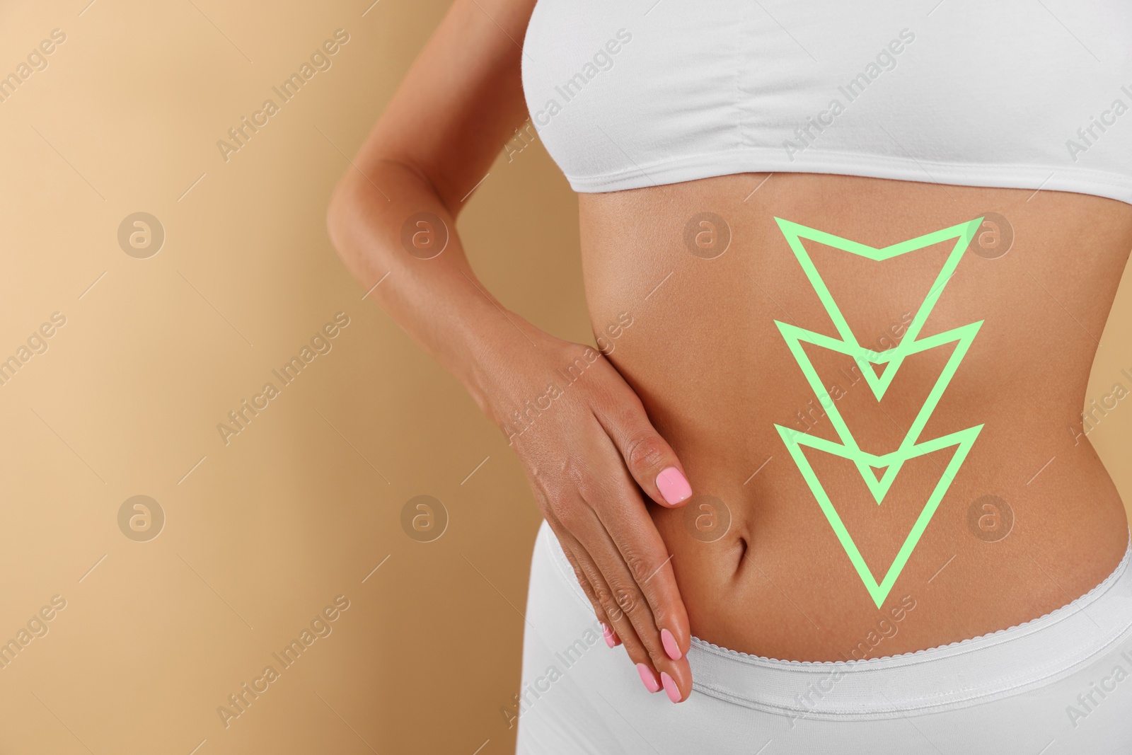 Image of Woman with healthy digestion on dark beige background, closeup. Arrows symbolizing proper functioning of digestive tract