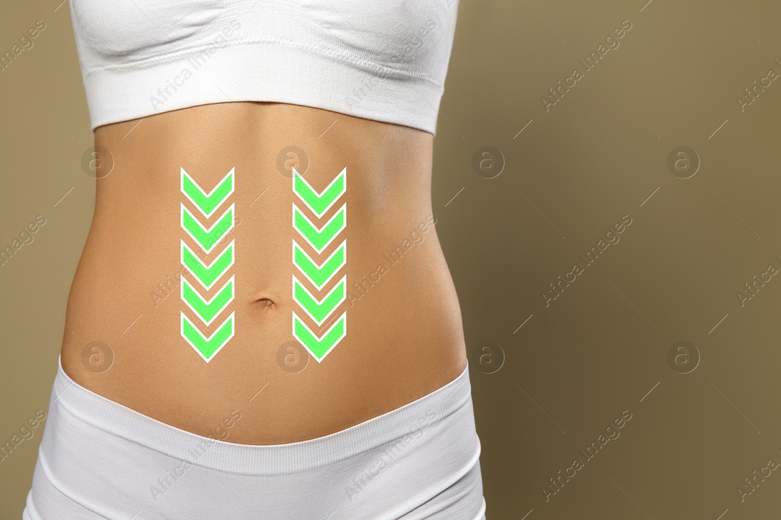 Image of Woman with healthy digestion on dark beige background, closeup. Arrows symbolizing proper functioning of digestive tract