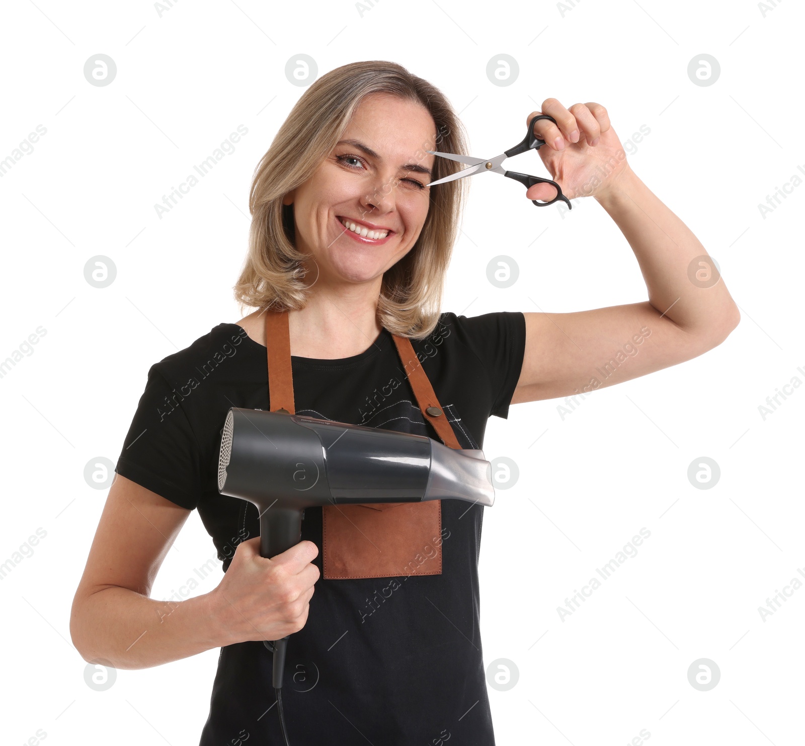 Photo of Smiling hairdresser with dryer and scissors on white background