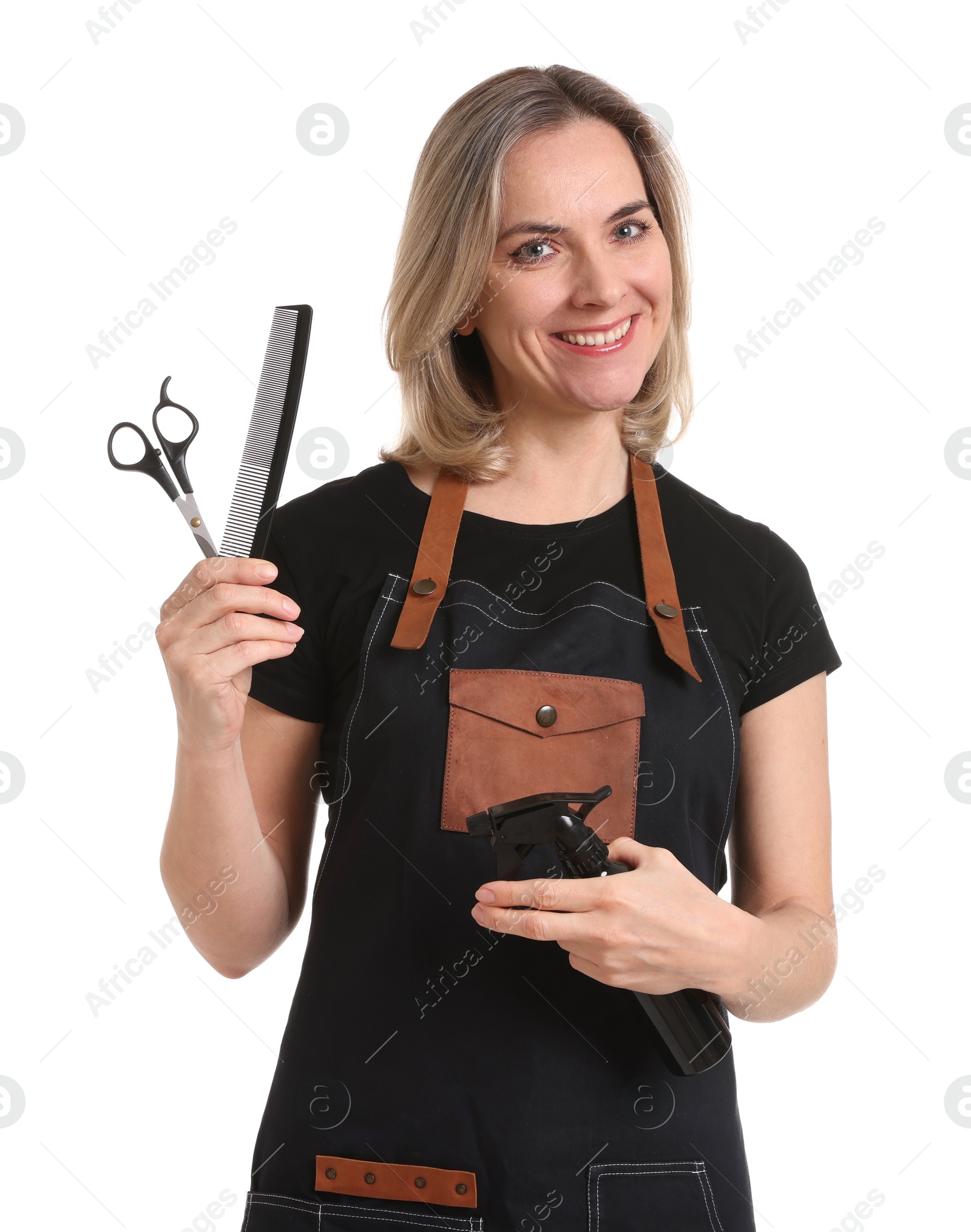 Photo of Smiling hairdresser with comb, scissors and spray bottle on white background