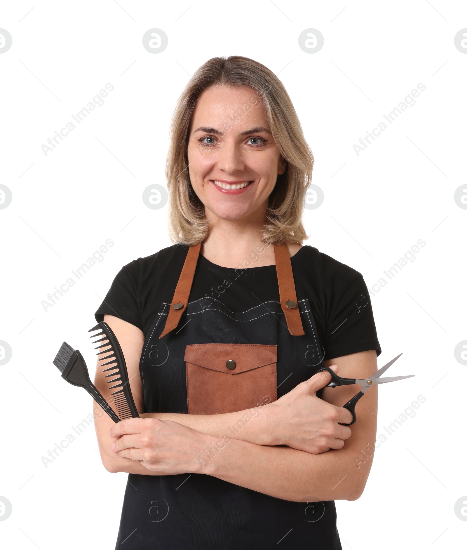 Photo of Smiling hairdresser with comb, hair dye brush and scissors on white background