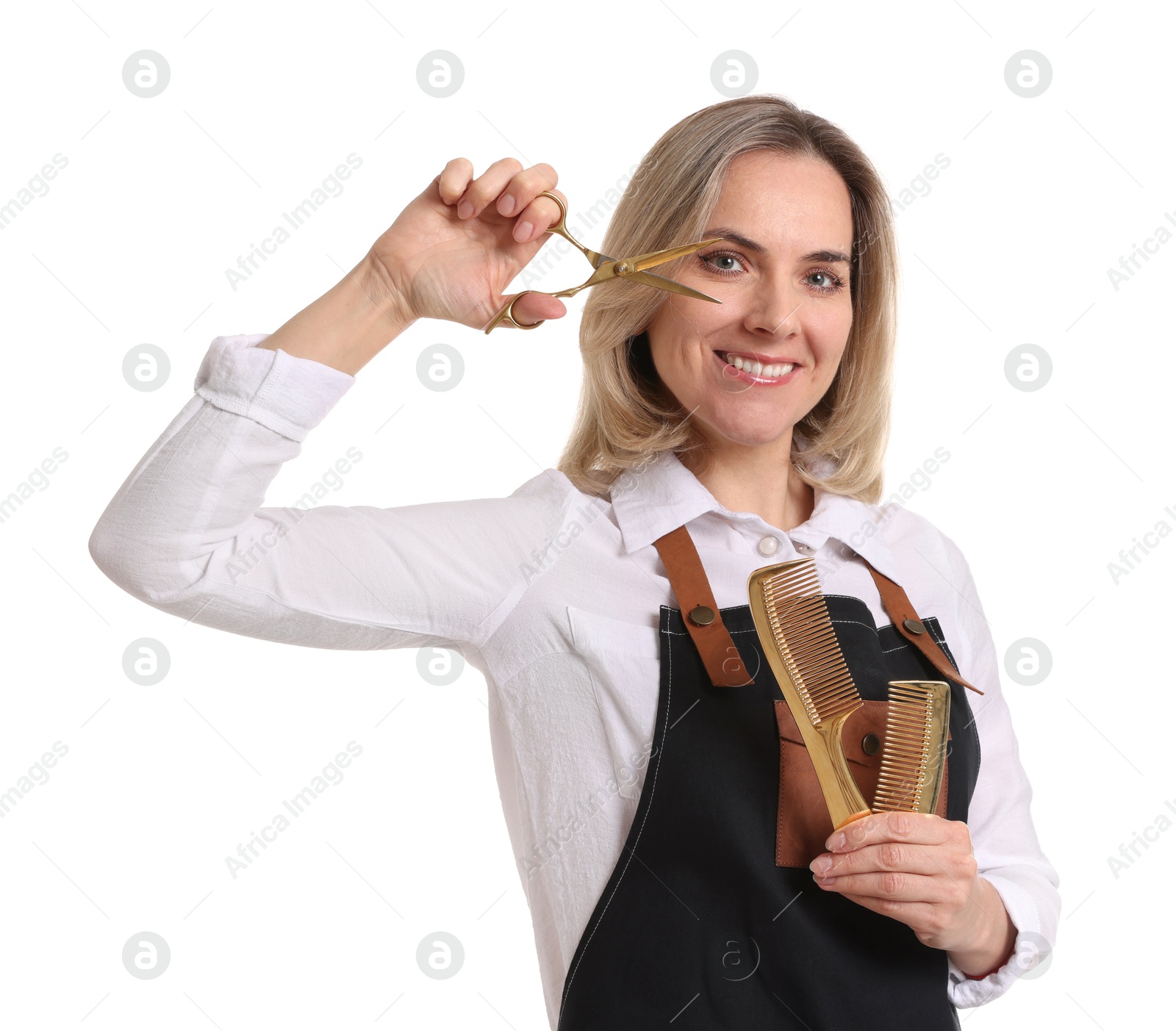 Photo of Smiling hairdresser with combs and scissors on white background