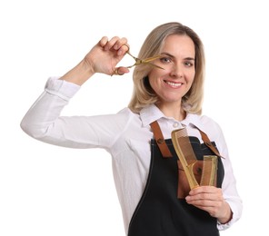 Photo of Smiling hairdresser with combs and scissors on white background