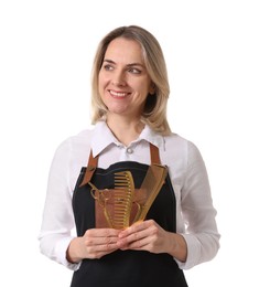 Photo of Smiling hairdresser with combs and scissors on white background