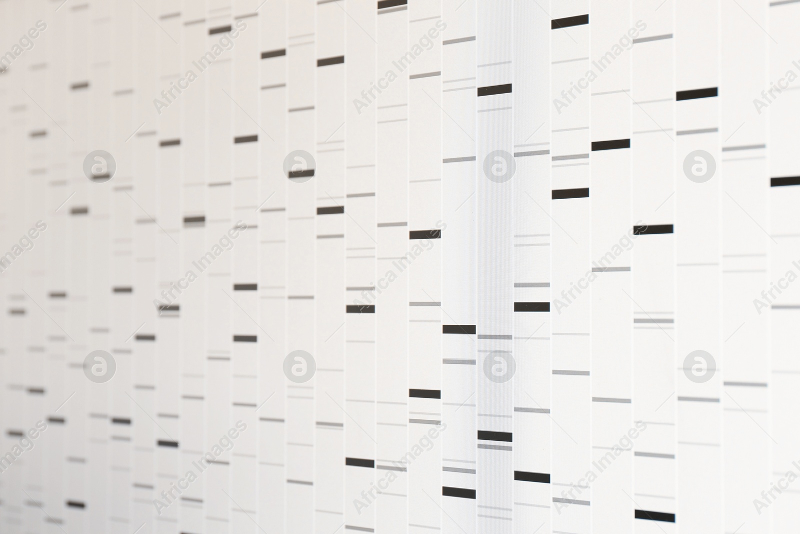 Photo of DNA analysis. Data with genetic information as background, closeup