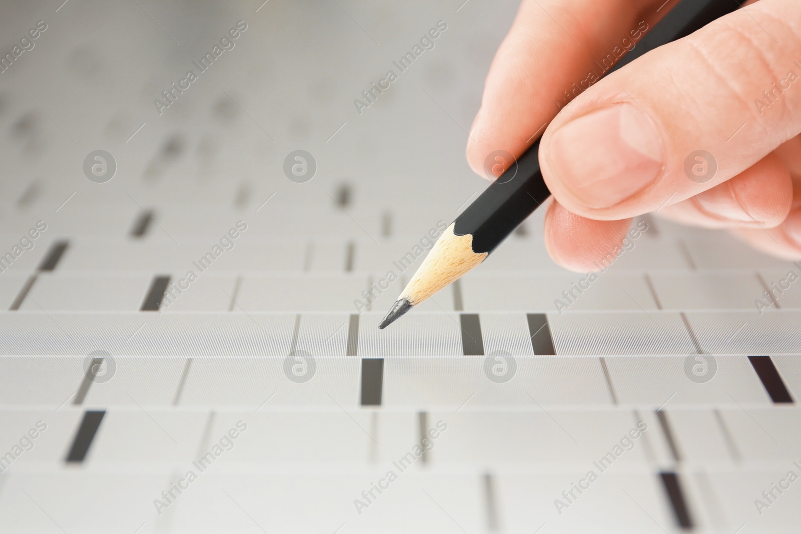 Photo of Scientist analyzing DNA data in laboratory, closeup