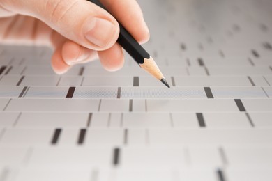 Photo of Scientist analyzing DNA data in laboratory, closeup