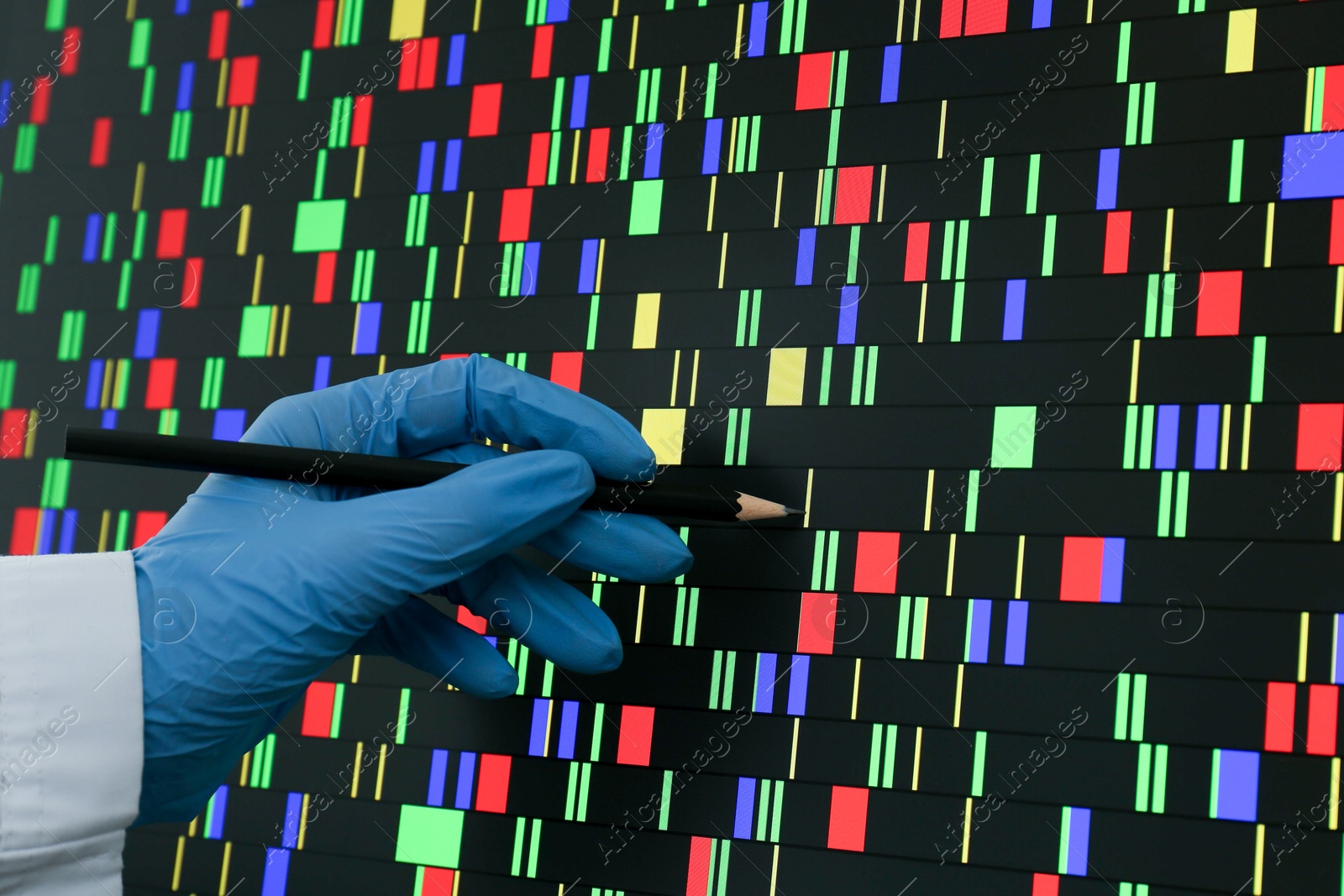 Photo of Scientist analyzing DNA data in laboratory, closeup