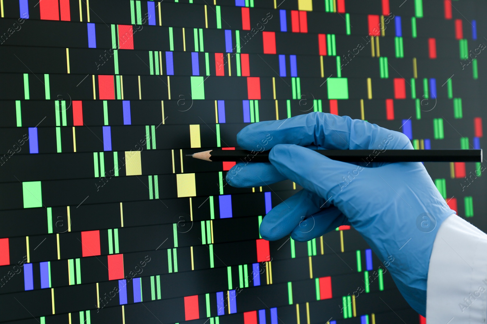 Photo of Scientist analyzing DNA data in laboratory, closeup