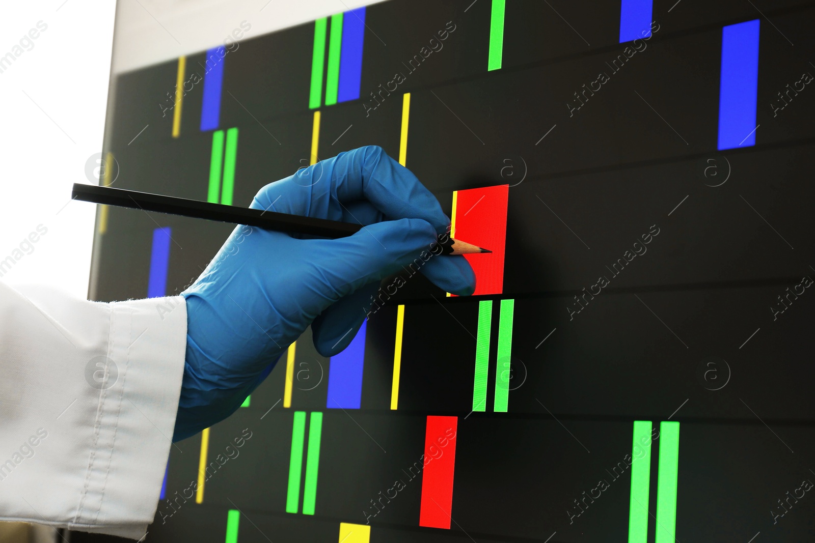 Photo of Scientist analyzing DNA data in laboratory, closeup