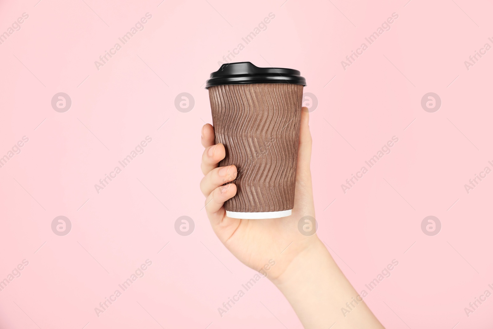 Woman holding paper cup on pink background, closeup. Mockup for design Photo of Woman holding paper cup on pink background, closeup. Mockup for design