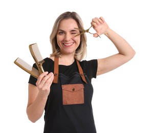 Photo of Smiling hairdresser with combs and scissors on white background