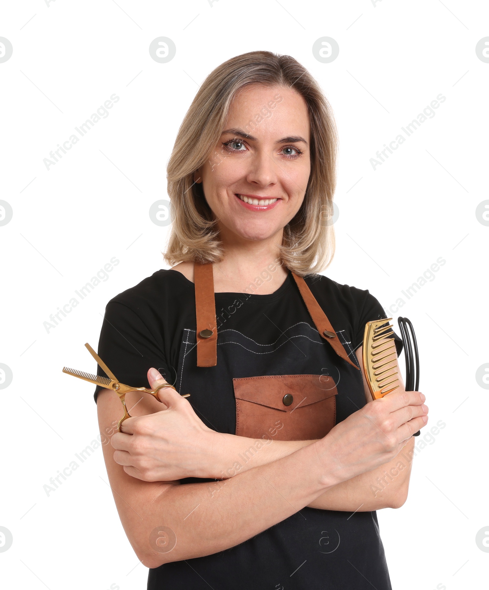 Photo of Smiling hairdresser with scissors, comb and hair clip on white background