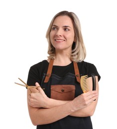 Photo of Smiling hairdresser with scissors, comb and hair clip on white background