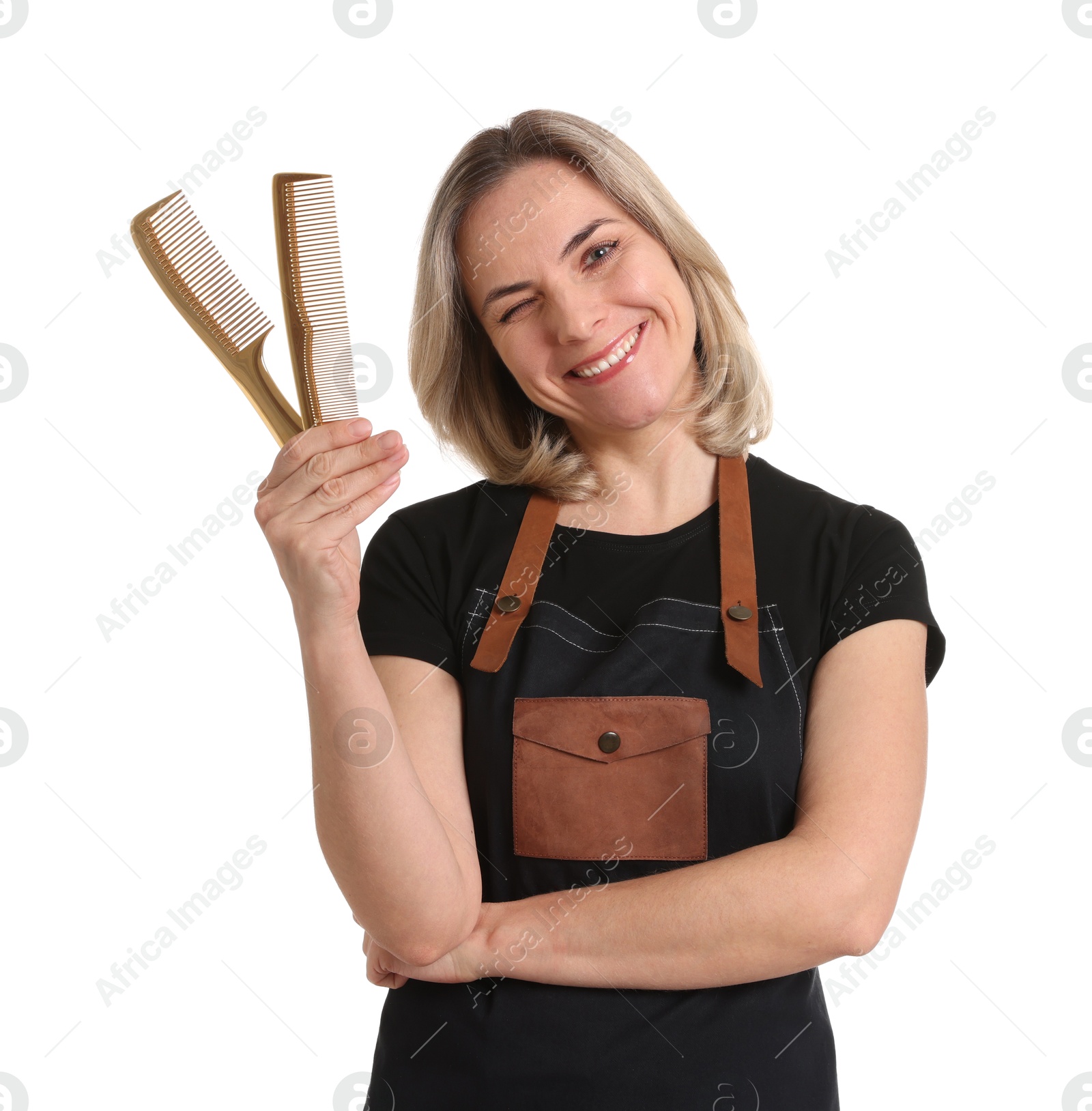 Photo of Smiling hairdresser with combs on white background