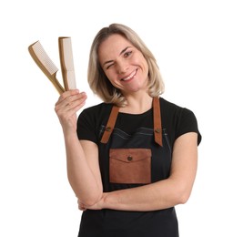 Photo of Smiling hairdresser with combs on white background