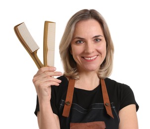 Photo of Smiling hairdresser with combs on white background