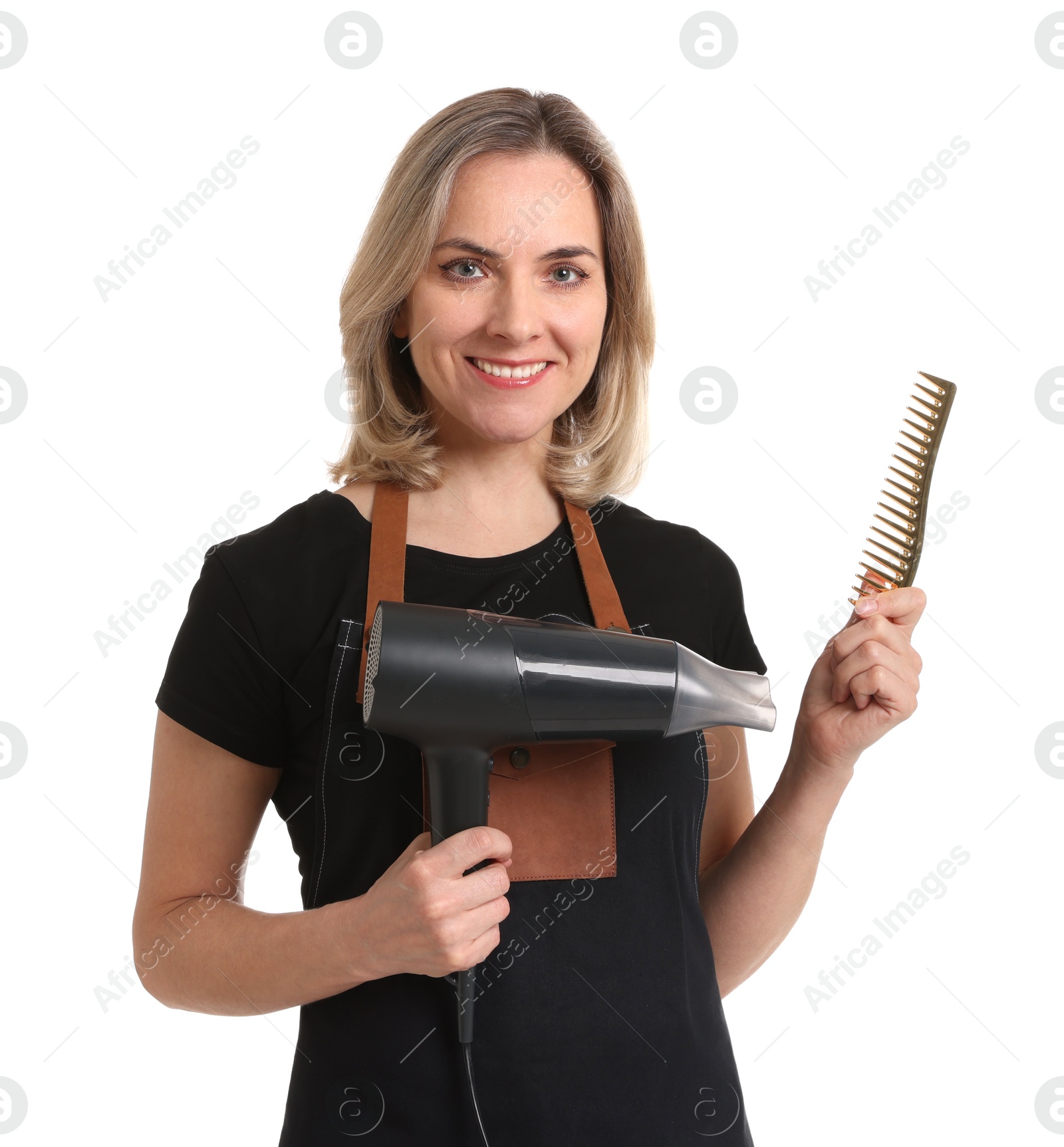 Photo of Smiling hairdresser with comb and dryer on white background