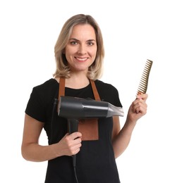 Photo of Smiling hairdresser with comb and dryer on white background