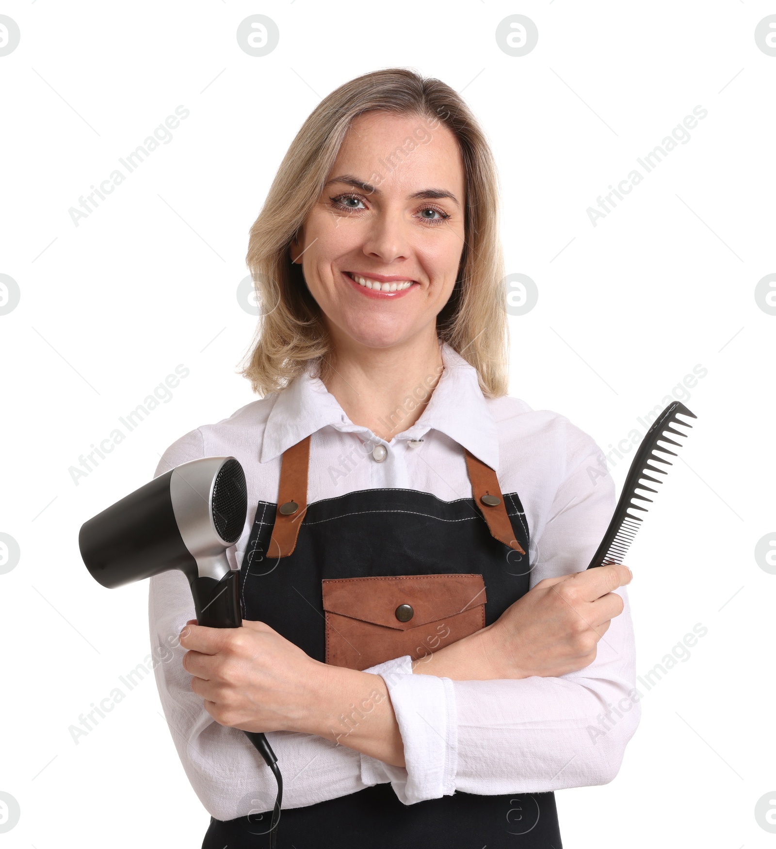 Photo of Smiling hairdresser with comb and dryer on white background