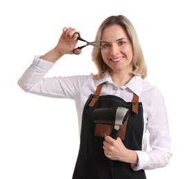 Photo of Smiling hairdresser with dryer and scissors on white background