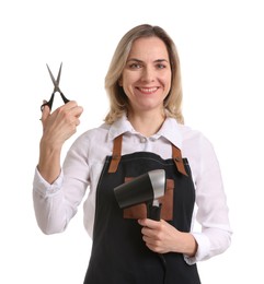 Photo of Smiling hairdresser with dryer and scissors on white background