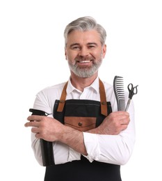 Photo of Smiling hairdresser with comb, scissors and spray bottle on white background