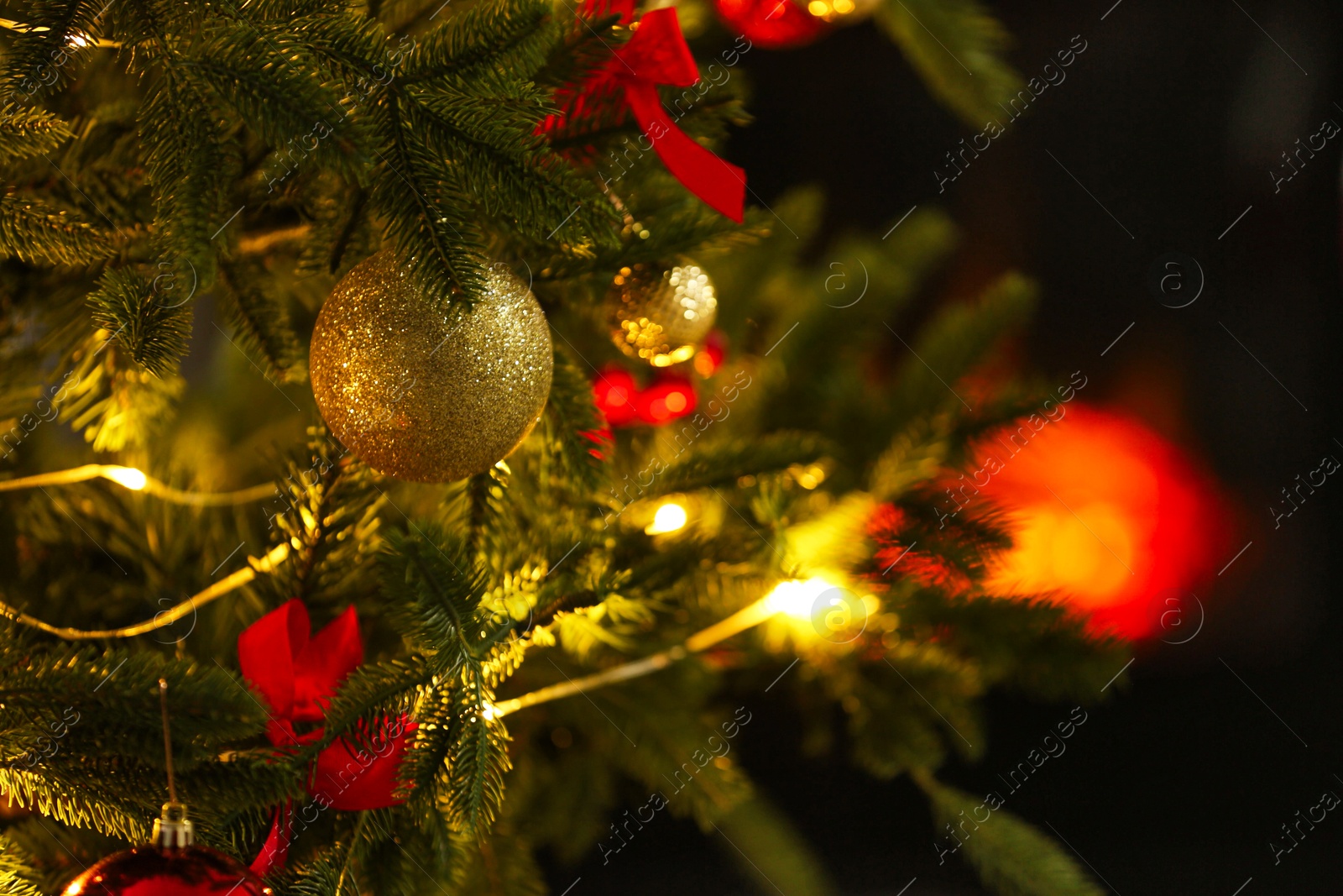 Photo of Beautiful decorated Christmas tree indoors, closeup. Space for text