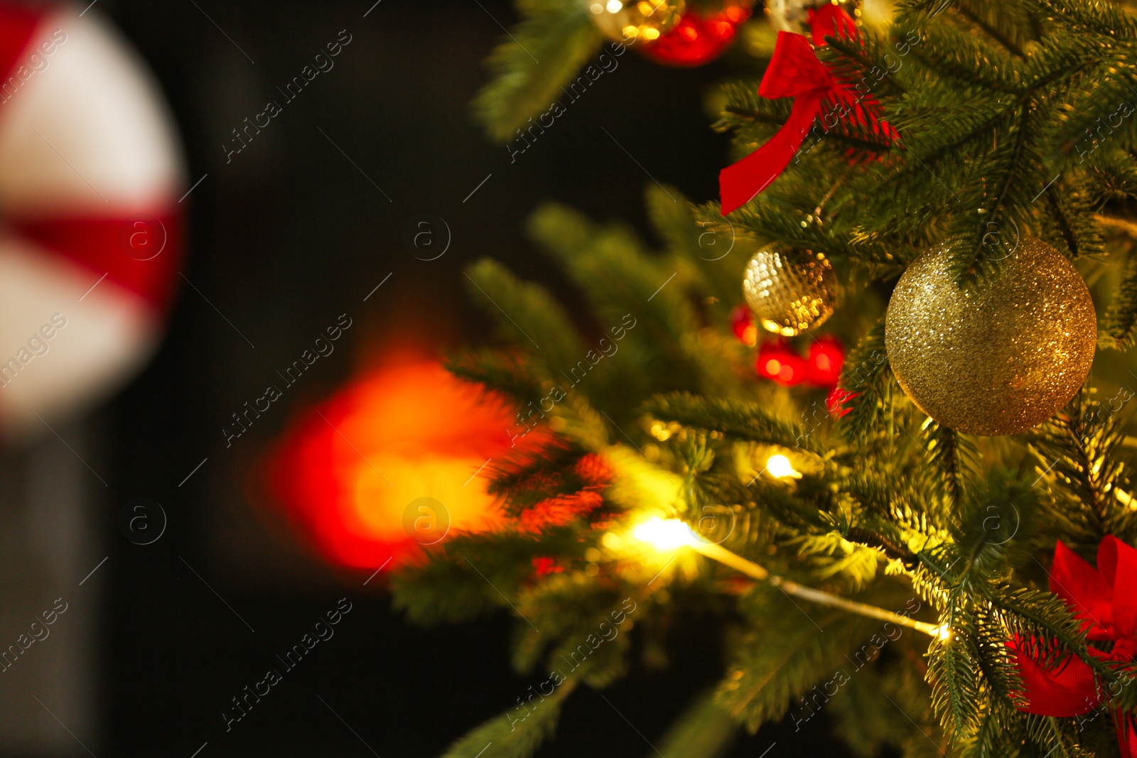 Photo of Beautiful decorated Christmas tree indoors, closeup. Space for text