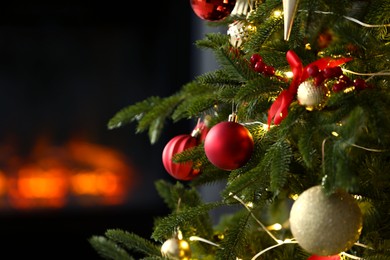 Photo of Beautiful decorated Christmas tree indoors, closeup. Space for text