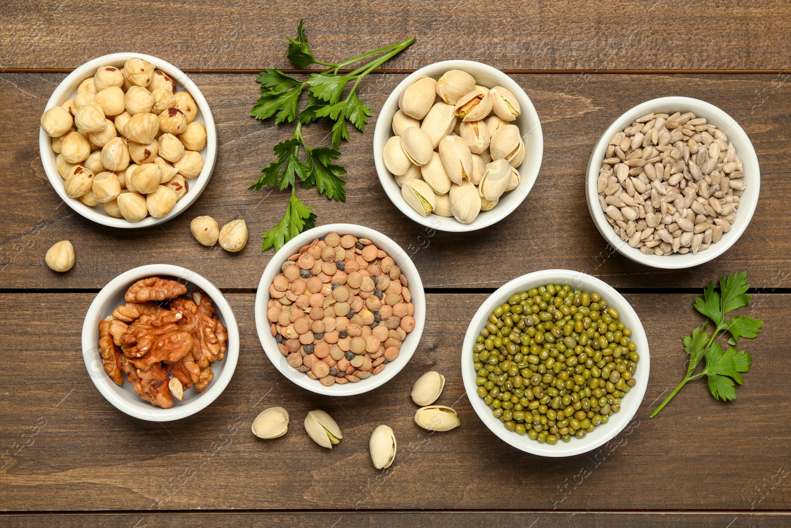 Photo of Superfood. Different healthy food products on wooden table, flat lay