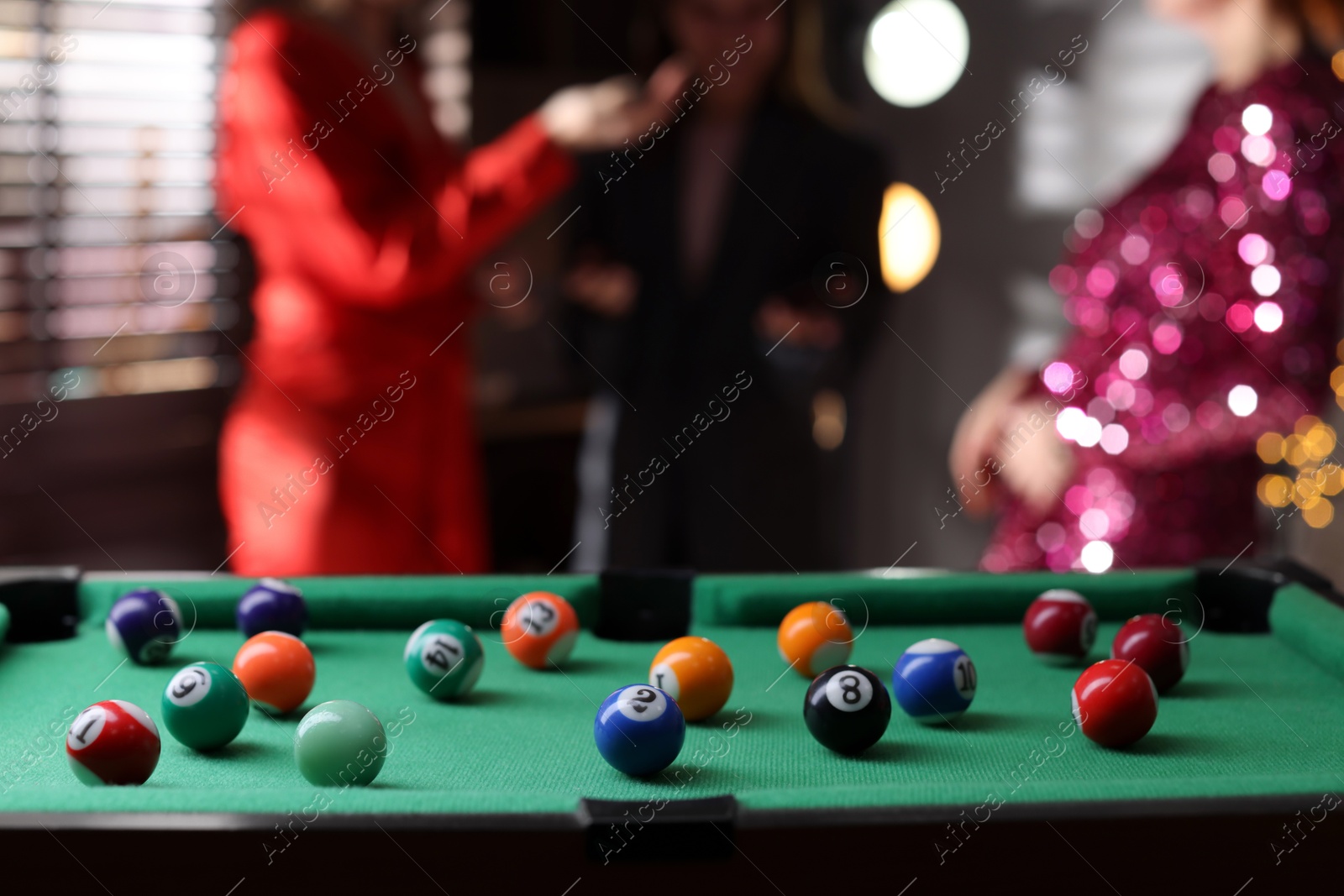 Photo of Many colorful billiard balls on green table indoors, space for text