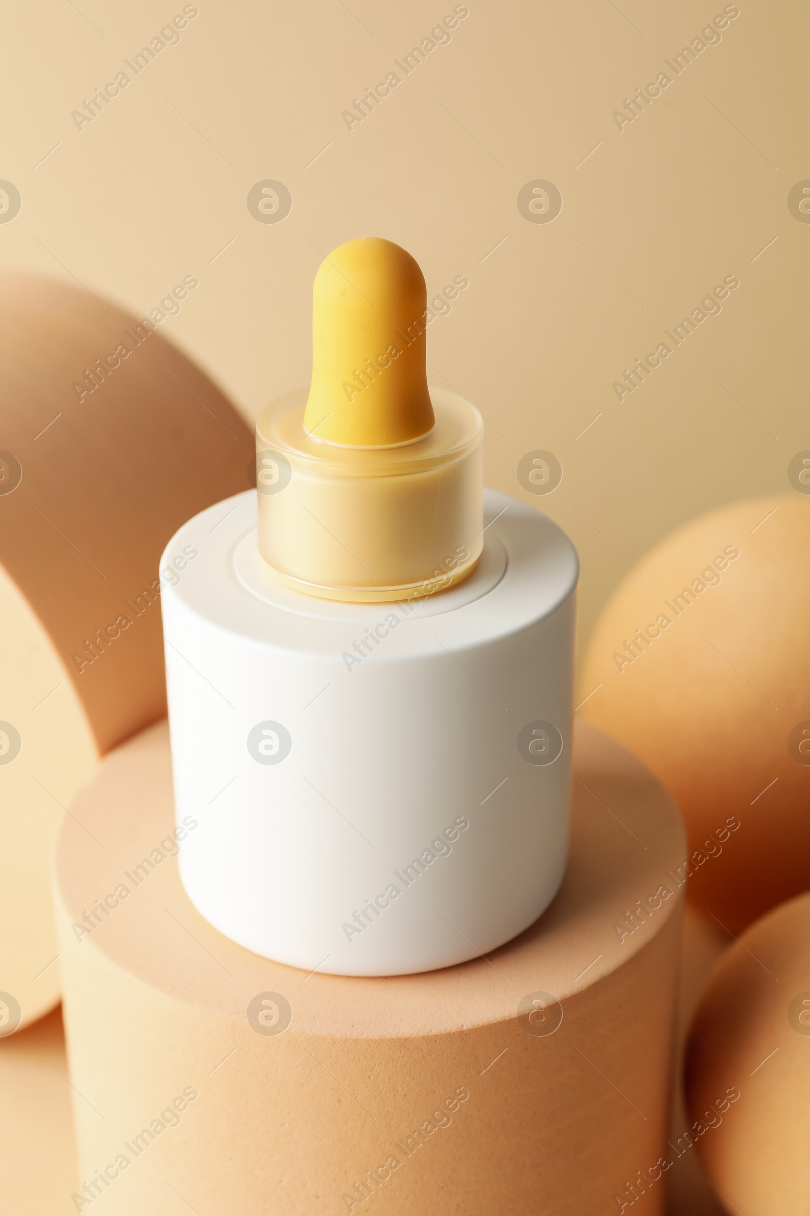 Photo of Stylish presentation of skin care product on beige background